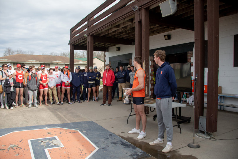 Two students giving a speech to their teams