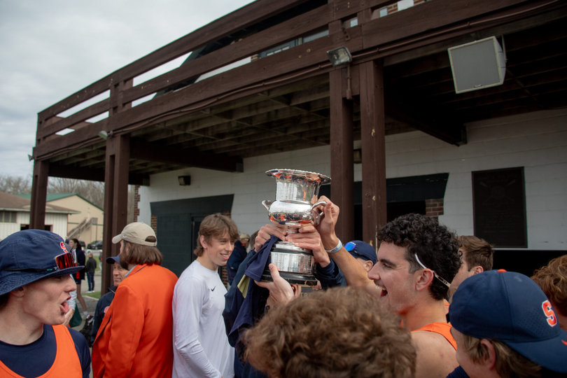 The team celebrates with the trophy