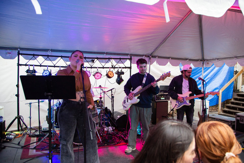 Three bandmembers on stage