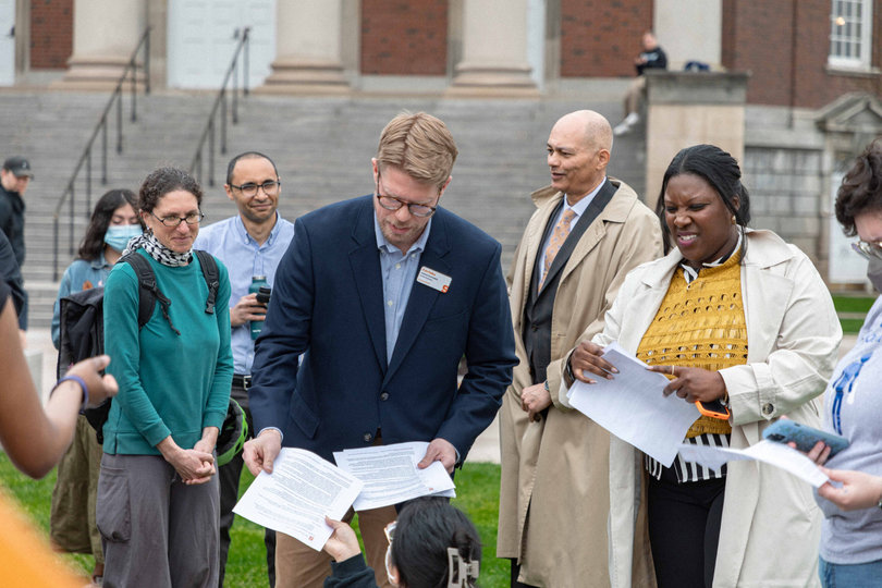 10:54 a.m., April 29, 2024 – SU administrators hand out papers that remind student protestors of their rights and responsibilities. Although protestors did not set up their tents in the designated spot, university administrators and DPS did not take action.
