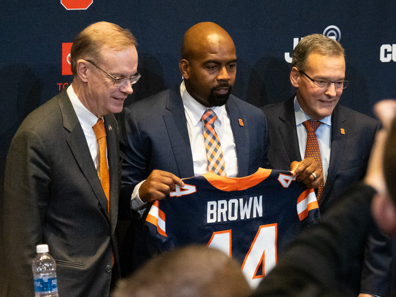 Syracuse football head coach Fran Brown (middle) poses with SU Director of Athletics John Wildhack (right) and Chancellor Kent Syverud (left) at his introductory press conference on Dec. 4. 
