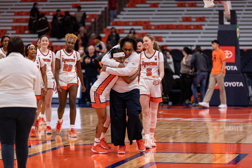 Syracuse women’s basketball head coach Felisha Legette-Jack and point guard Dyaisha Fair share a warm embrace after Syracuse’s 83-82 win over Clemson on Jan. 14. Fair scored 21 points to pass the 3,000 point mark for her career and help the Orange come back from a 19-point deficit in the second half.
