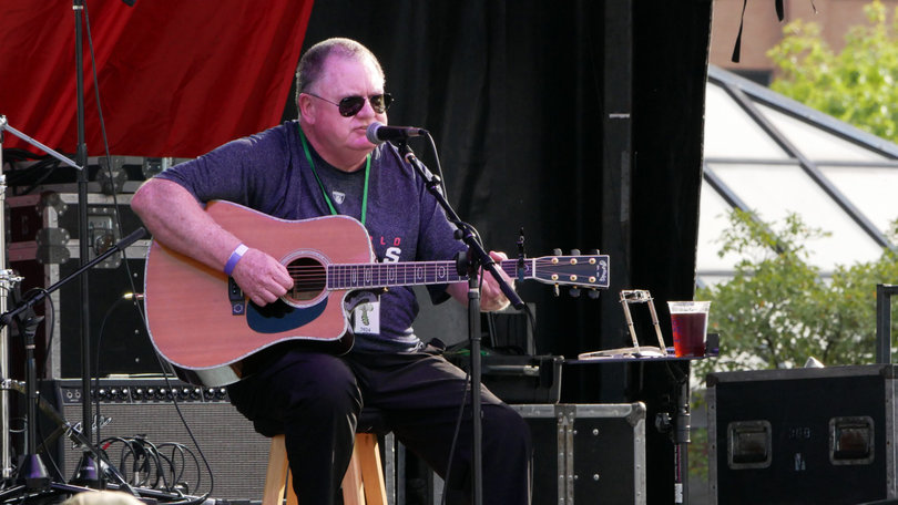 Kevin Flanagan performs before a crowd of festival patrons. He proceeded to play at the Pub Stage two more times during the night.
