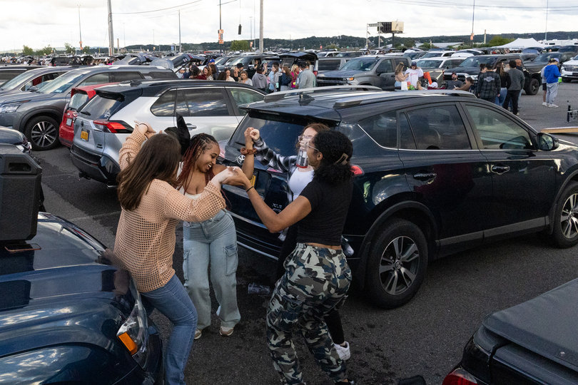 Ebony Byrd, Julie Graham, Aliyah Gravante and Leeya Wilkins, all Onondaga Community College students, danced in the parking lot for over an hour before the night’s first set. They were among many other tailgaters celebrating before the show’s start. 
