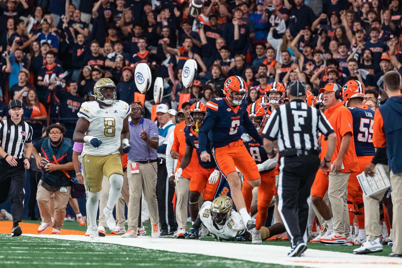 Syracuse quarterback Kyle McCord celebrates in front of SU’s sideline after scrambling for a first down in the third quarter. SU head coach Fran Brown has emphasized McCord’s use of his legs for extending plays.
