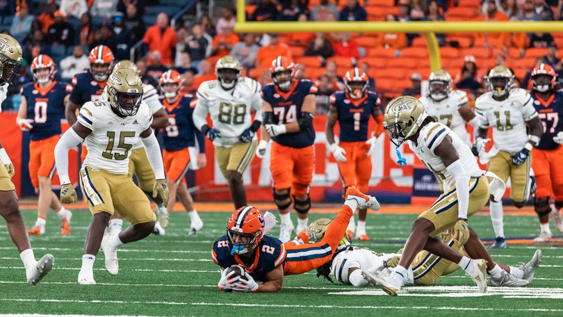 Syracuse wide receiver Trebor Peña secures a catch over the middle between several Georgia Tech defenders. Peña recorded six catches for 88 yards and two touchdowns against the Yellow Jackets.
