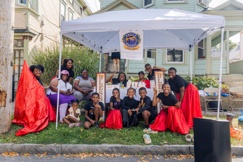 The Greater Rescue Apostolic Church Evangelistic Ministries gathers after a street performance during the Westcott Street Cultural Fair. G.R.A.C.E is a local church inspired by worship, praise and deliverance.

