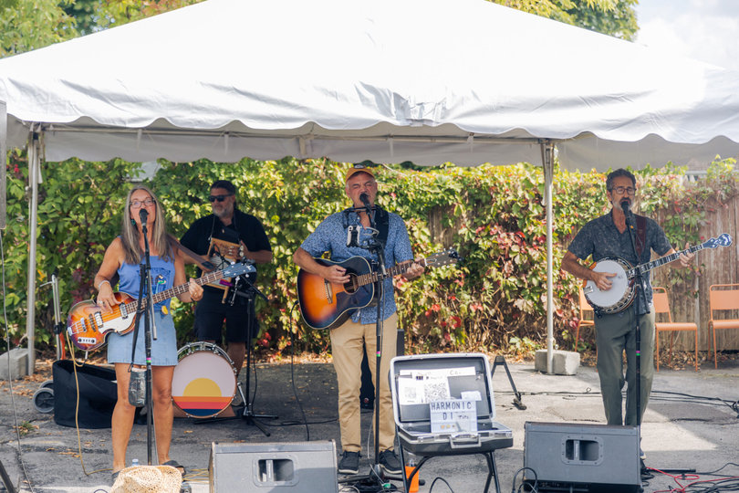 A local Syracuse band energizes a crowd with its performance. The Fair had six performance stages, each used throughout the event.
