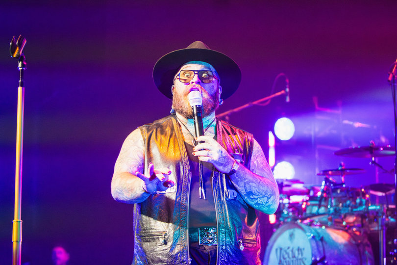 Under colorful beams of light, Teddy Swims stares into the audience. His personality was on full display for his show.
