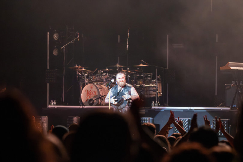Teddy Swims places his hat over his heart in the middle of his show. He became emotional as fans give him a standing ovation for his song “Simple Things.”

