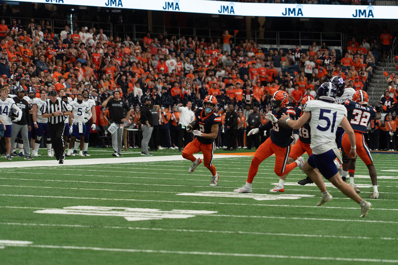 Trebor Pena, SU’s wide receiver, returns a punt in the Family Weekend football game against College of the Holy Cross. The game was an opportunity for families to experience a popular part of SU culture. 

