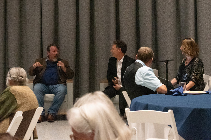 Three people talking to an audience.