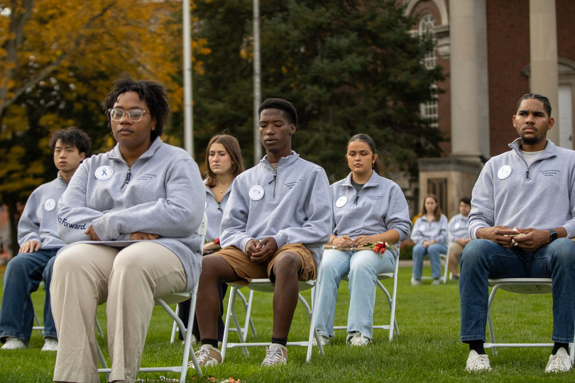 A group of people sitting in chairs.