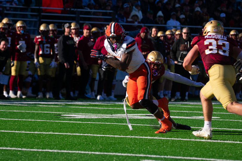 SU running back LeQuint Allen Jr. breaks a tackle from a BC defender. Allen Jr. rushed for 50 yards and two touchdowns against the Eagles. 
