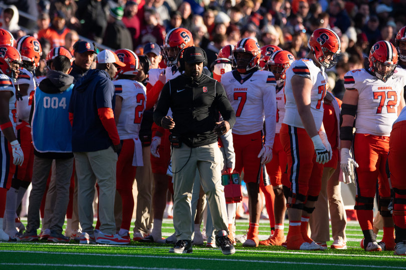 Syracuse head coach Fran Brown roams the sideline, with sunlight and shade draped upon him, during SU’s loss to BC. Brown has totaled a 6-3 record through the first nine games of his first year at the helm.