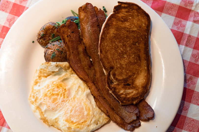 An On the Fly classic breakfast includes eggs, bacon, toast and potatoes. Several restaurantgoers ordered the plate for a late Saturday breakfast. 

