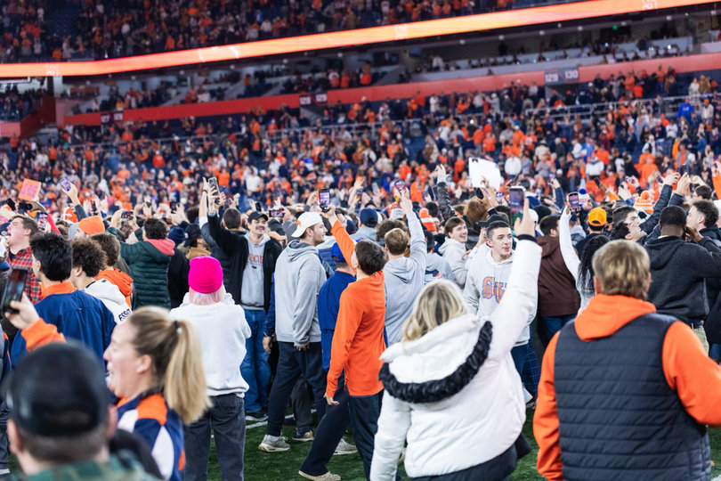Fans flood the field to celebrate with the team after the clock hit triple zeroes. Syracuse’s defense forced a field goal with minutes to play, and its offense ran out the clock to seal the game. 
