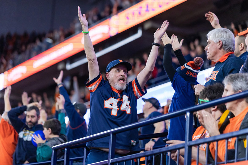 Syracuse supporters celebrate following a late touchdown score to push the Orange ahead. After falling behind 21-0, SU completed its largest comeback in program history to escape with a four-point win. 
