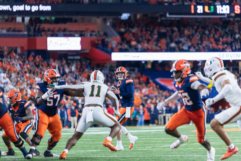 SU quarterback Kyle McCord pans left before taking a shot at the end zone. McCord capped his historic season with 380 passing yards and three touchdowns against Miami, shattering the program’s single-season passing records in the process.
