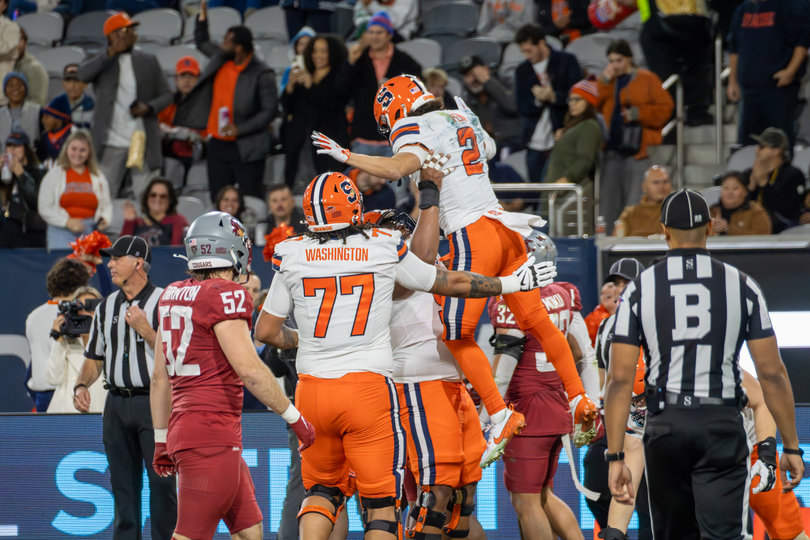 Syracuse wide receiver Trebor Peña leaps into the air with the help of his offensive line following a first-quarter touchdown. Peña led the Orange in 2024 with 84 receptions and nine receiving touchdowns.