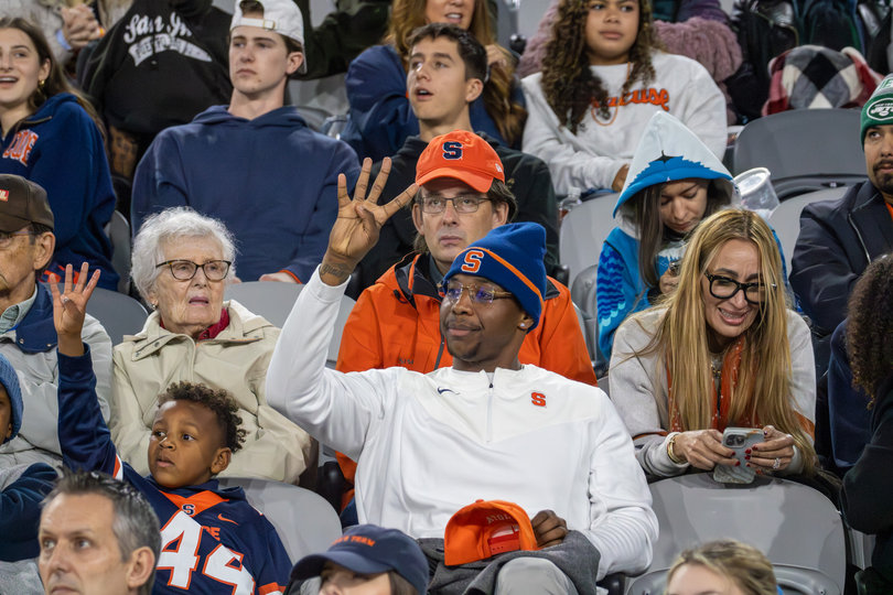 Syracuse fans hold up the number four to signal the beginning of the fourth quarter. The announced attendance for the Holiday Bowl in Snapdragon Stadium was 23,902. 