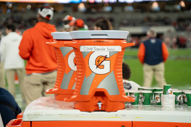 Syracuse labels one of its sideline Gatorade coolers as “Coug Transfer Juice.” Washington State had over 30 players enter the transfer portal, most notably losing their star quarterback John Mateer to Oklahoma.