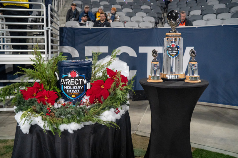 The Holiday Bowl trophy along with the bucket of eggnog patiently waited to be awarded to the victor. As part of postgame festivities, the tradition is for the winning head to be doused in the bucket of eggnog.