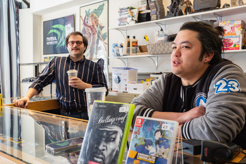 Alex Silver and Xuan Tran are co-owners of Megaton Games in Eastwood, Syracuse. The two banter behind the counter as customers dash in and out of the store.