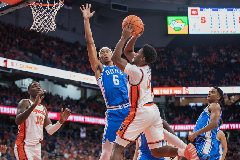 Kyle Cuffe Jr. drives the baseline against Duke forward Maliq Brown, who spent his first two NCAA seasons at Syracuse. Brown led all players with a +24 plus/minus.