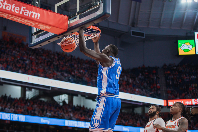 Duke center Khaman Maluach flushes a dunk in the first half as SU’s Eddie Lampkin Jr. and Jyáre Davis are forced to look on. The South Sudan native is averaging 8.0 points per game in his freshman campaign.