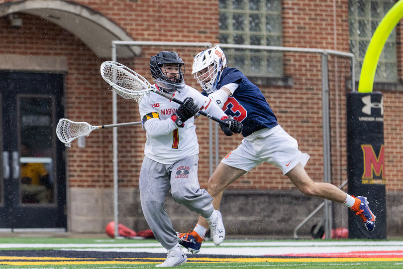 Attacker Finn Thomson (pictured, blue jersey) fights on the ride with Maryland goalie Logan McNaney (pictured, No. 1) as he tries to clear the ball. Thomson was held to just one goal by the Terrapins’ defense in his lowest-scoring game of the 2025 season. 