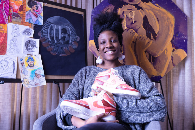 Chemical engineering student Ilana Robbins holds custom-painted Air Jordan sneakers. Beyond creating work on paper, Robbins enjoys decorating her belongings and painting on unconventional mediums.