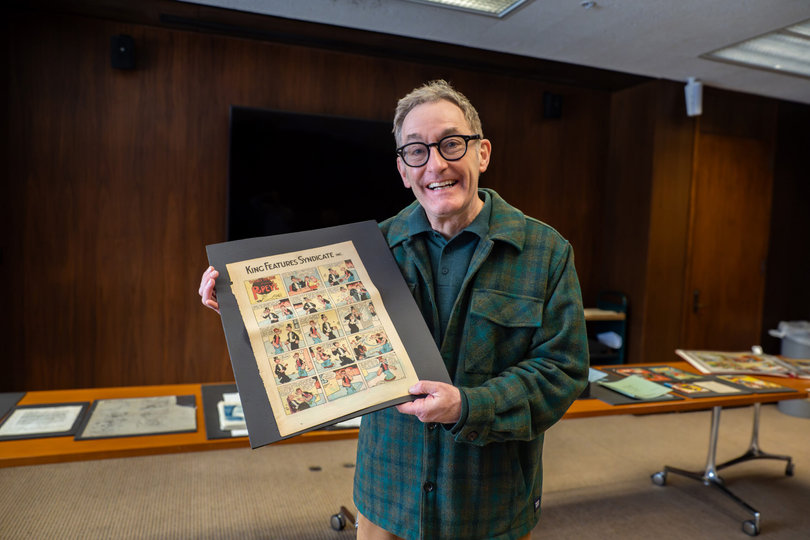 Tom Kenny, the voice of SpongeBob, sorts through comic book archives at Syracuse University’s Bird Library. Kenny, who’s originally from Syraucse, visited SU to discuss his career with students.