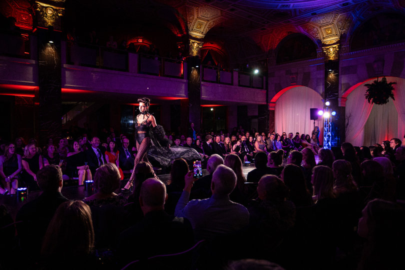 Models made their final walk down the runway in their elaborate outfits as the show comes to a close.