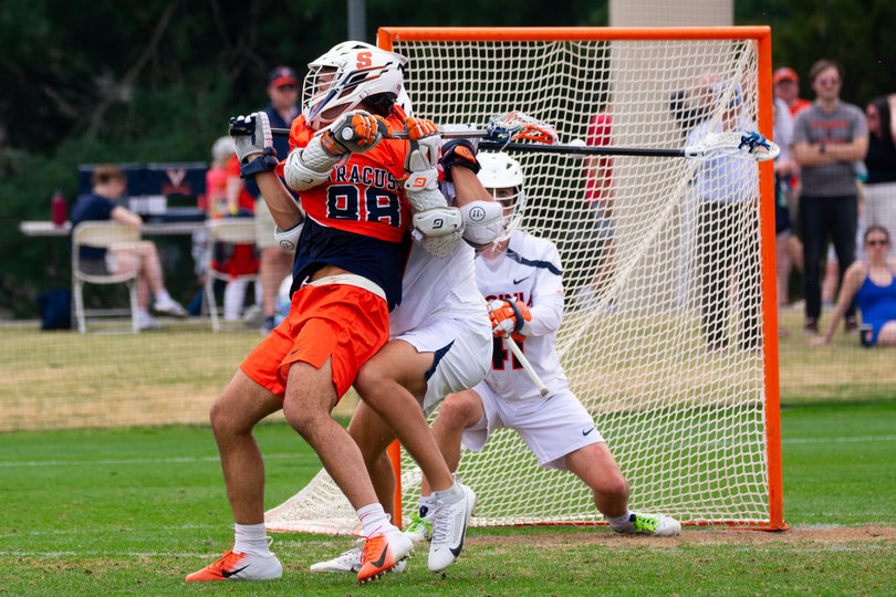 Payton Anderson attempts a difficult behind-the-back shot early in Syracuse’s contest with Virginia Saturday. Anderson, a 6-foot-3, 220-pound freshman, made his first-career start for the Orange against the Cavaliers and tallied two goals in SU’s winning effort. 