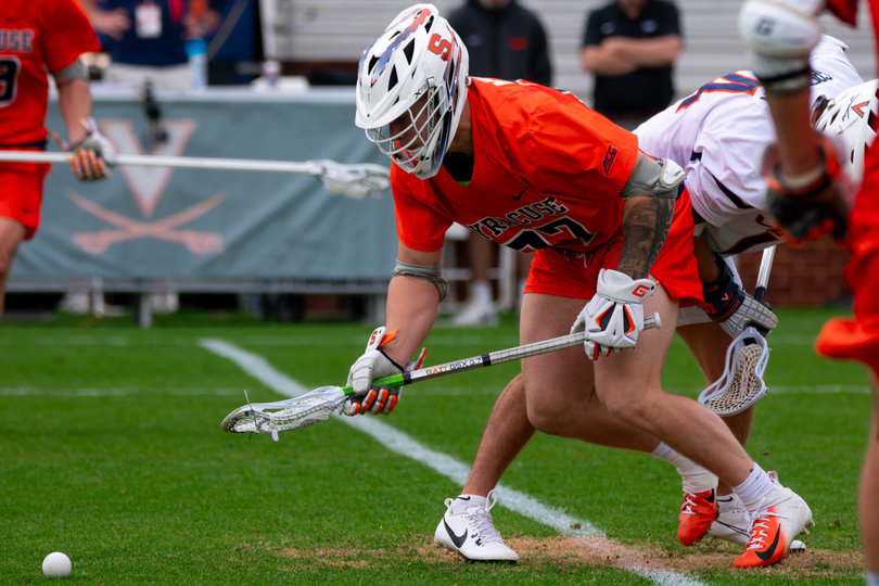 John Mullen wins the initial clamp on a faceoff against Virginia faceoff specialist Andrew Greenspan. Though he entered Saturday with the fourth-best winning percentage at the X in the country, Mullen won just 9-of-22 faceoffs against UVA, as Greenspan finished 13-of-18.