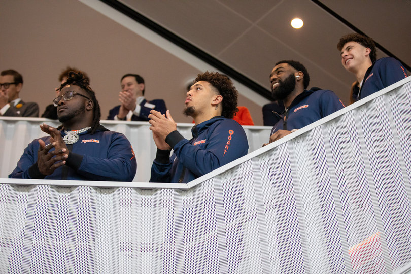 Dion “Tank” Wilson Jr. (left), Denis Jaquez Jr. (second from left), Duce Chestnut (second from right) and Tommy Porter (right) line the stairs during Saturday’s program. SU head coach Fran Brown told the seniors they deserve the new facility “more than anybody.”