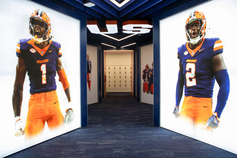 LeQuint Allen Jr. (left) and Marlowe Wax (right) are enshrined in Syracuse’s new facility. Allen Jr. finished his SU career with 3,207 scrimmage yards, while Wax totaled 338 tackles.