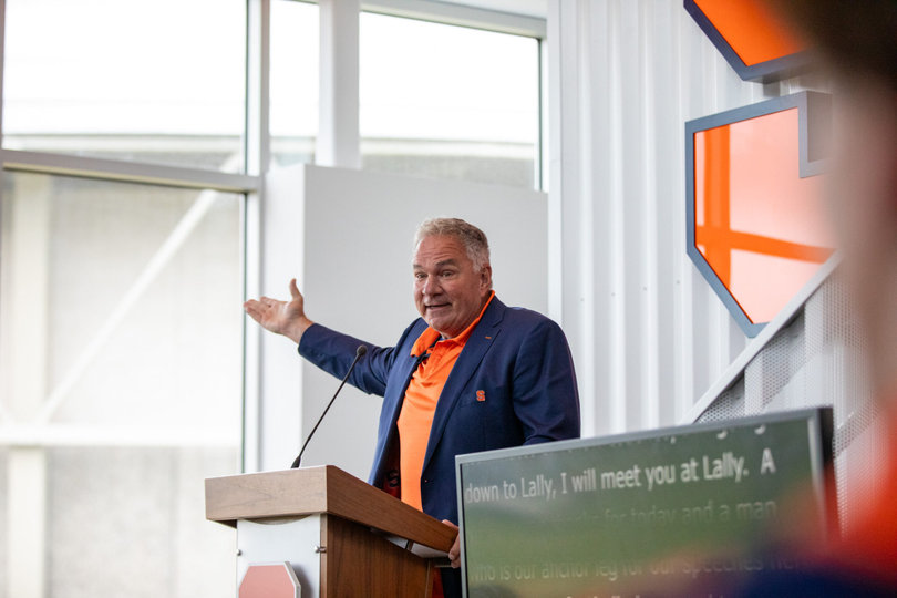 John Lally, who led the fundraising efforts for Syracuse’s new facility, addresses the audience during the football performance center’s ribbon cutting. Lally said the Orange aren’t happy with just being a top-20 team, and that they’ll win the ACC in 2025.