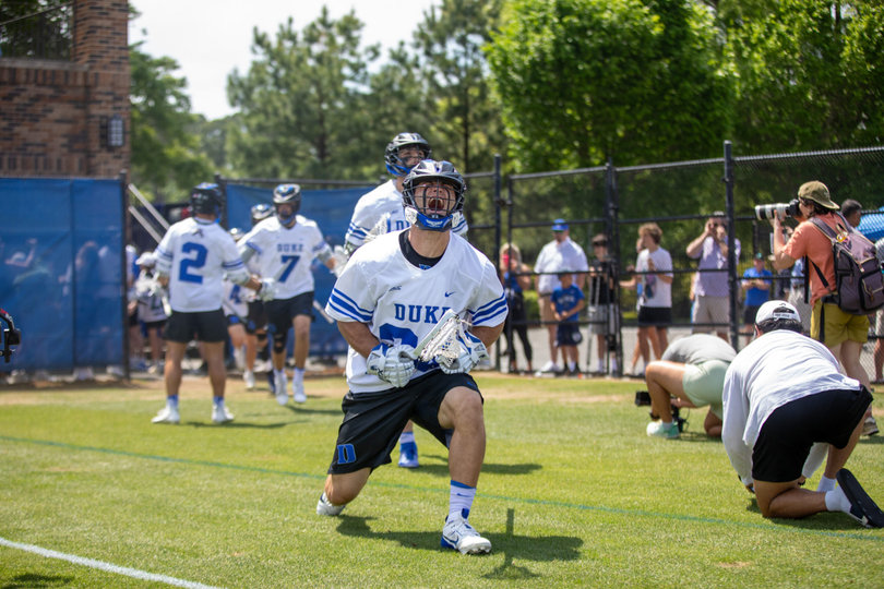 Duke graduate student long-stick midfielder Tommy Drago screams in exaltation pregame as he enters the field. Drago and the rest of the Blue Devils’ midfielders silenced the Orange’s attack to gain a valuable ACC win.