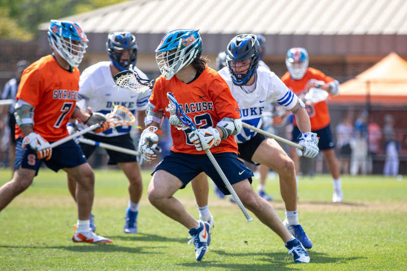Syracuse attack Joey Spallina (No. 22) cuts to his right as Duke midfielder Max Sloat pressures him from behind. Spallina bounced back from his one-goal performance against Cornell with five points versus the Blue Devils, but it wasn’t enough to come away with the win.