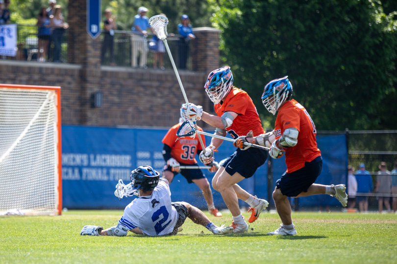 As Duke midfielder Andrew McAdorey (No. 2) hits the grass at Koskinen Stadium, he is closely harried by Syracuse’s defender Billy Dwan III (center) and short-stick midfielder Carter Rice (right). Nonetheless, McAdorey tormented SU’s backline Saturday, registering one goal and two assists.