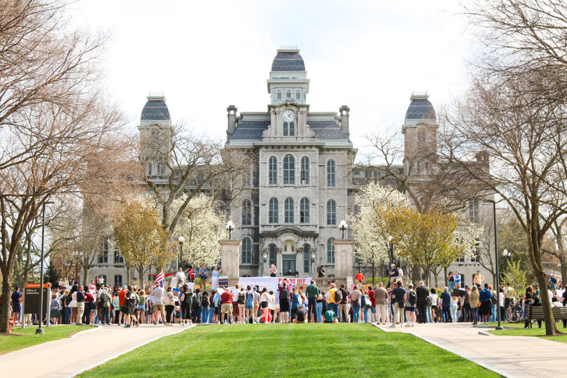 Protesters lined the Einhorn Family walk on Thursday afternoon for the “Hands Off!” protest in front of the Hall of Languages. Students and faculty demanded protection for immigrants, academic freedoms and reproductive rights.