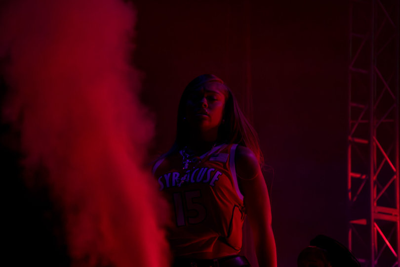 Latto sports a Syracuse University basketball jersey with Carmelo Anthony’s name for her performance in the JMA Wireless Dome. The rapper headlined this year’s Block Party.