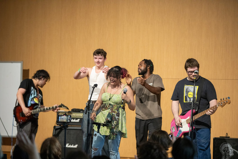 Fans rush the stage to join in and dance with The Schwegs. The band gave them hugs and smiles as they continued their set.