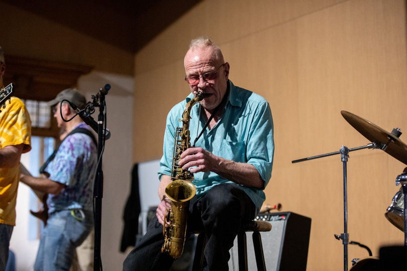 Acid Reign’s saxophonist belts out tunes onstage at Quadstock. He performed a number of solos throughout the band’s set. 