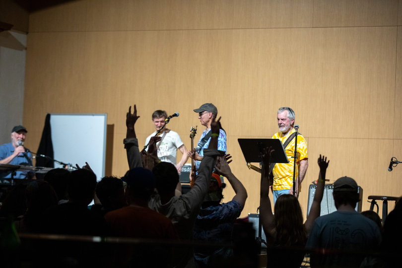 Students yell for an encore of the song “Free Bird” during Acid Reign’s set. Acid Reign is a band made up of Syracuse locals and SUNY ESF professors with over 20 years of playing experience. 