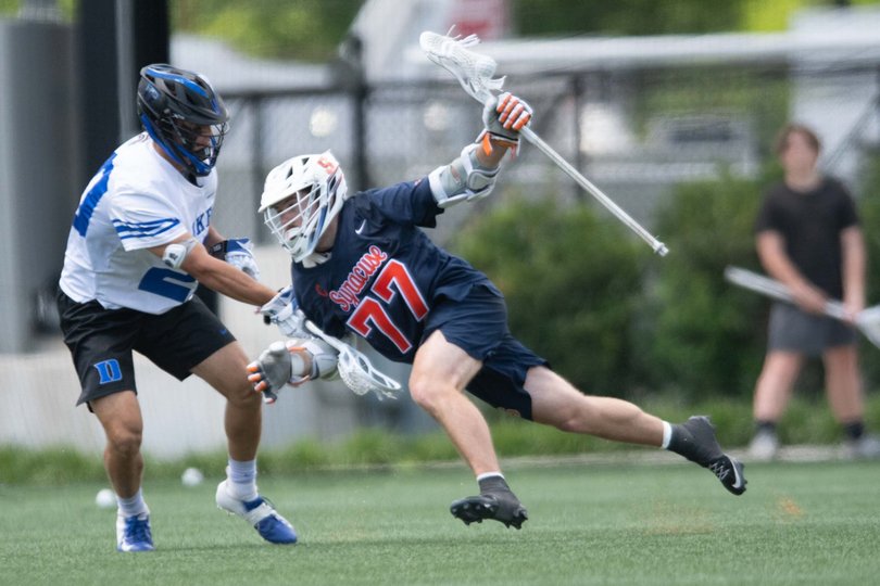 Owen Hiltz attempts to wrap his way around Duke defenseman Jack Gray. Hiltz notched two goals in Syracuse’s ACC Tournament win over the Blue Devils.