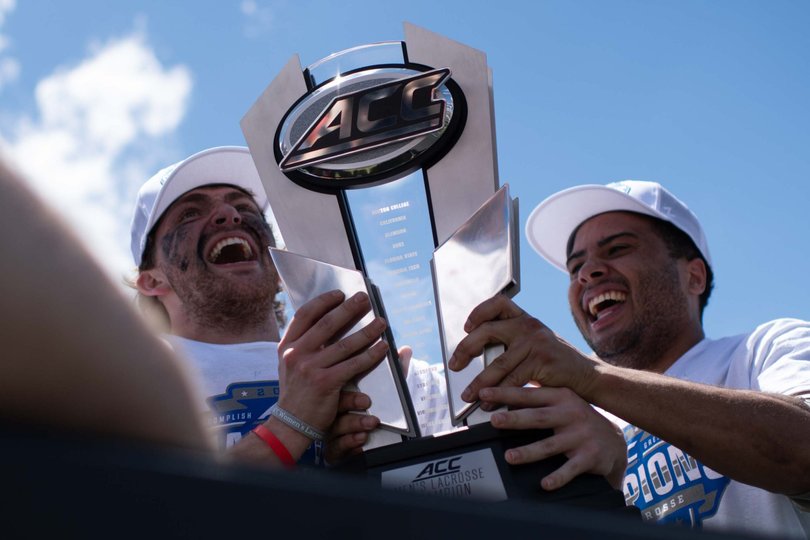 Brett Spallina and Carter Rice lift the ACC Tournament trophy. No. 4 Seed Syracuse defeated No. 3 Seed Duke 9-8 to claim the ACC Championship. 