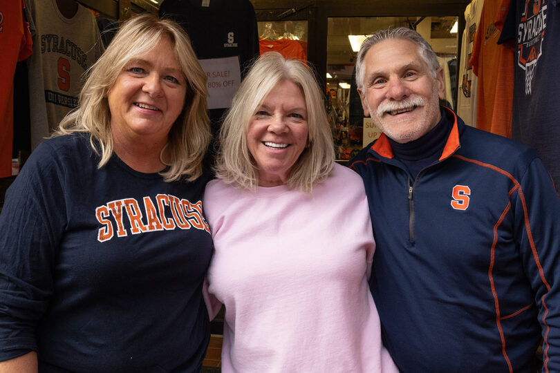 Oct. 28, 2024: Wendy Hennessey, Sandra Jacobs and Dave Jacobs (left to right) stand in front of Shirt World — an independently-owned Syracuse University merchandise store. After 48 years, the store officially closed its doors.